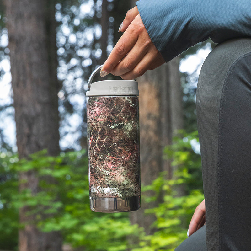 12oz-tkwide-with-twist-cap-mossy-oak-a2 12oz_tumbler_mossyoak_rainbowtrout_hand_closeup_square.jpg